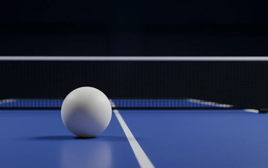 Duo de joueurs de tennis de table en match de doubles autour de la table