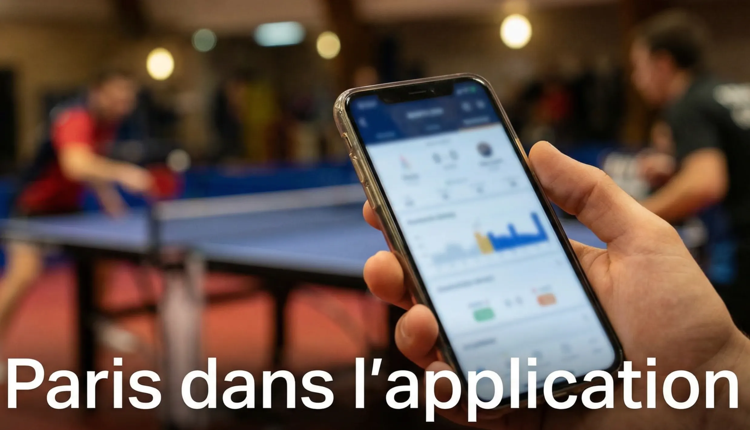 Smartphone affichant une application de paris sportifs lors d'un match de tennis de table